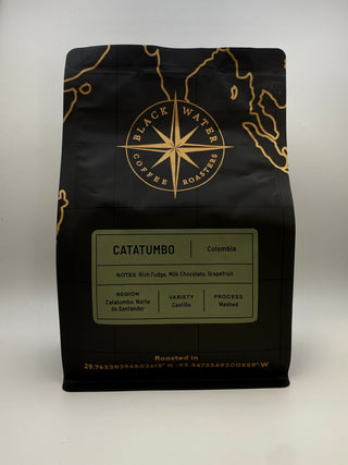 Black coffee bag with gold accents featuring 'Black Water Coffee Roasters' on a white background with a Catatumbo (Colombia) label