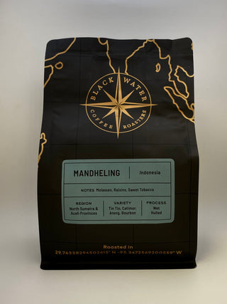 Black coffee bag with gold accents featuring 'Black Water Coffee Roasters' on a white background with a Mandheling (Indonesia) label